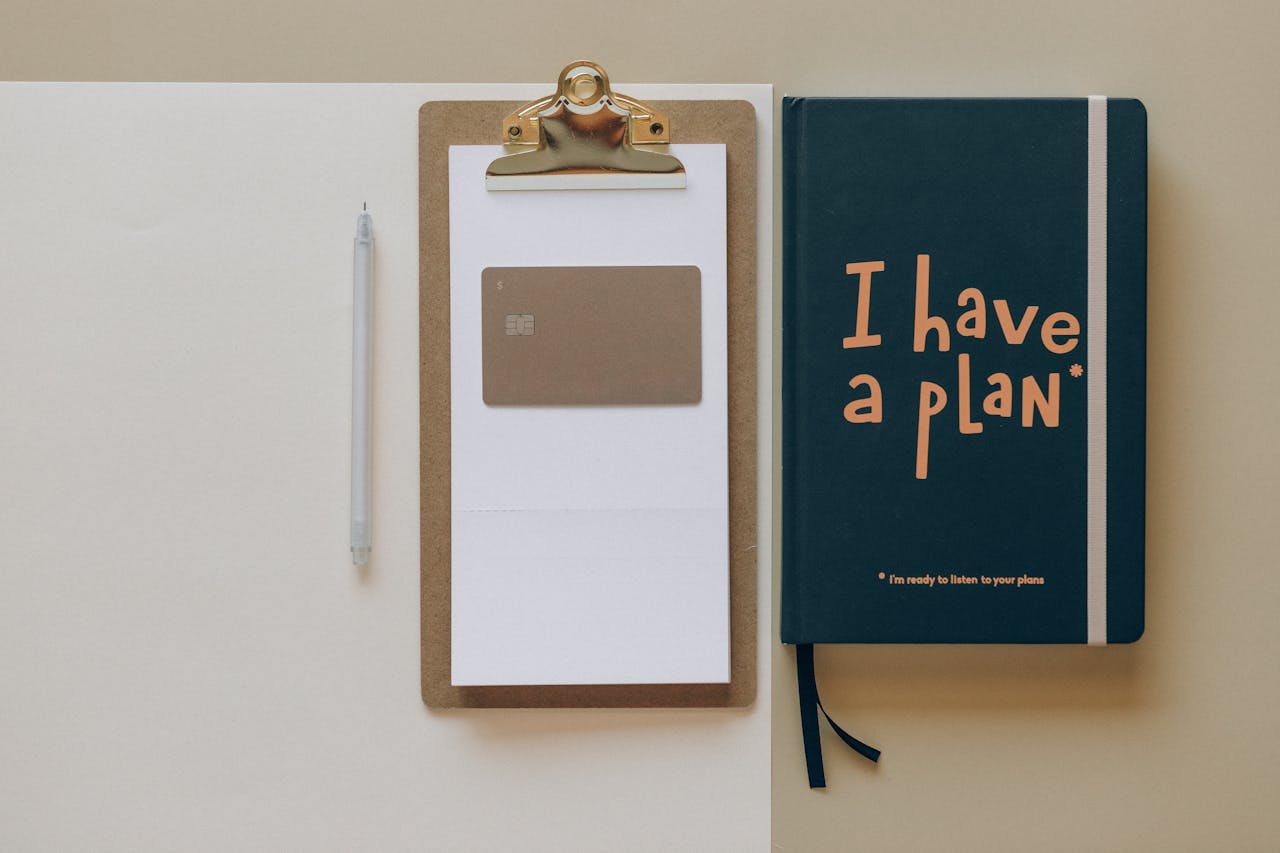 Crafting Captivating Headlines: Your awesome post title goes here A minimalist office setup featuring a planner, clipboard, card, and pen, perfect for planning and organization.